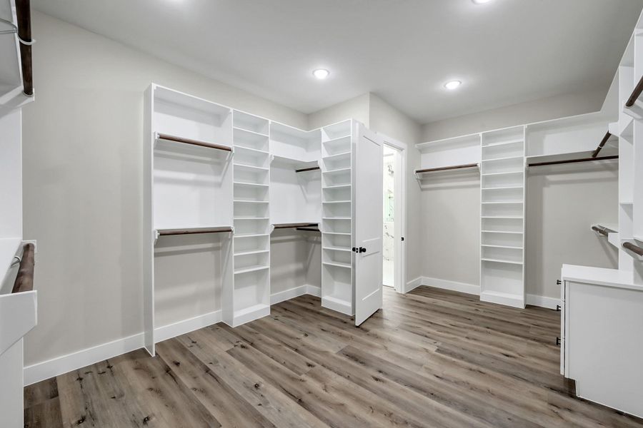 Primary walk-in closet Primary walk-in closet