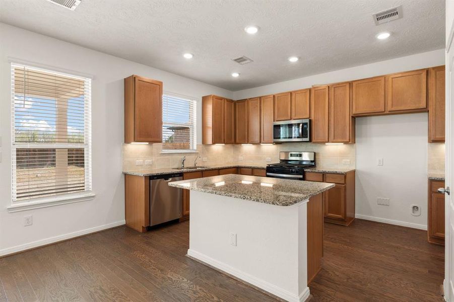 Any chef's dream, this stunning kitchen is perfect for everyday life as well as entertaining family and friends! Extra large kitchen island is perfect for conversation or that much needed space to lay out your party spread for everyone to enjoy! Large windows provide lovely views of your backyard and plenty of natural lighting throughout the day.