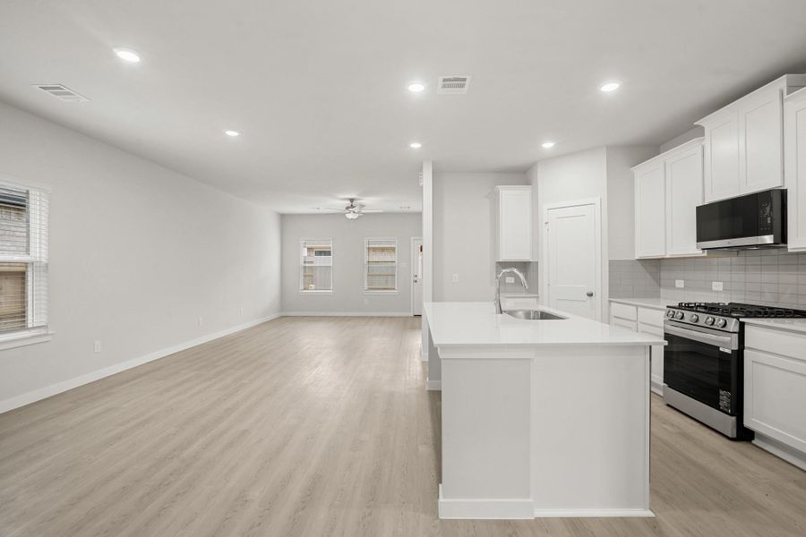 Furnished interior view inside a new home in Sunterra, Katy (Image 8).
