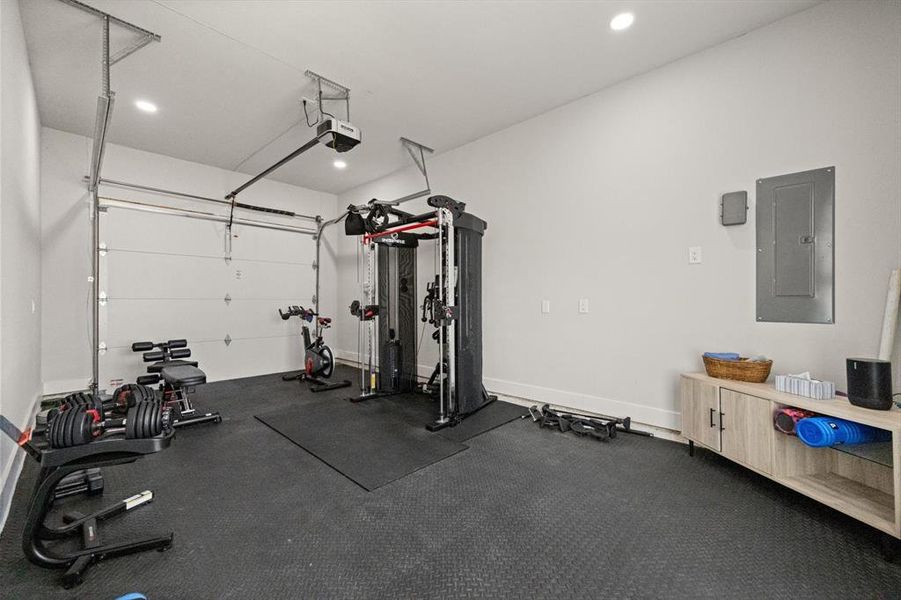 Workout area with overhead door to the view and removable rubber flooring. Definitely a flexible space with options to fit your needs!