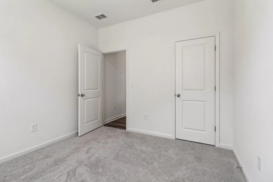 Representative unfurnished interior of a home built from the Larissa by Starlight Homes in Crescent Pointe, Carrollton (Image 18).