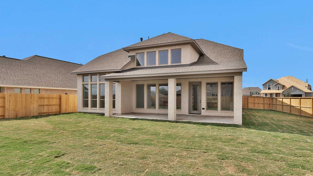 Exterior details and patio area of a home in Elyson 55', Katy (Image 1).