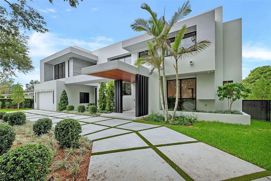 Front exterior of a new home in , Pinecrest, FL, highlighting curb appeal (Image 26).