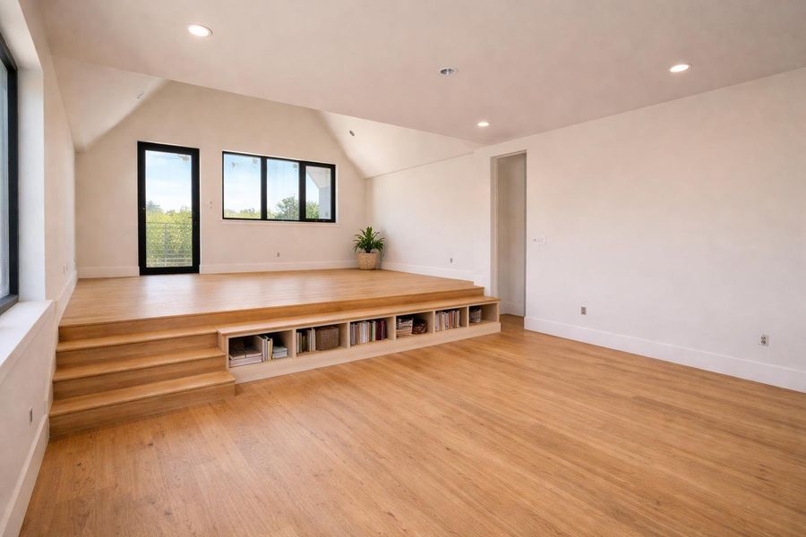Light filled primary bedroom with a flexible layout for a sitting area or office, offering privacy and direct access to a private balcony to unwind.