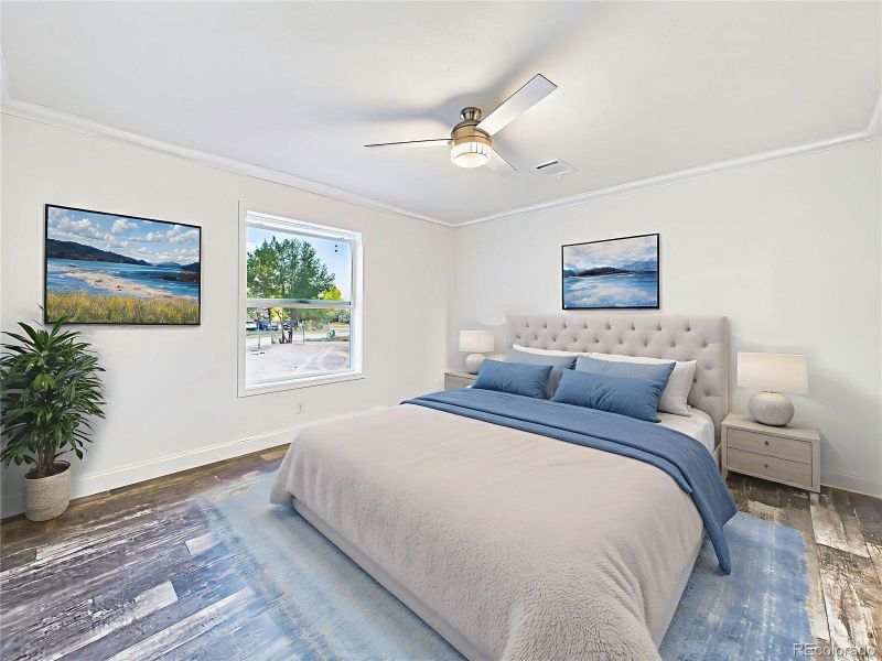 Virtually staged version shows layout options with a king bed, nightstands, and artwork.