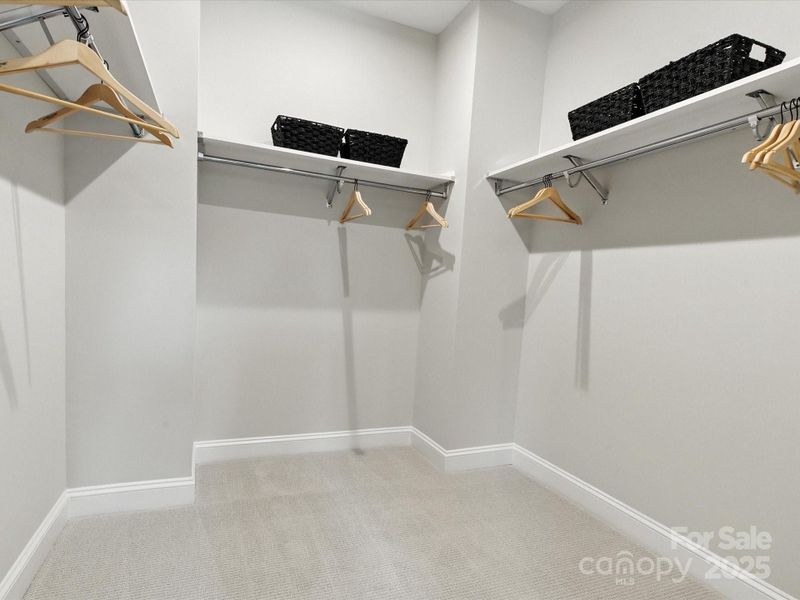 Huge primary walk-in closet. *Model Photos | Actual finishes, orientation, and structural selections may vary.