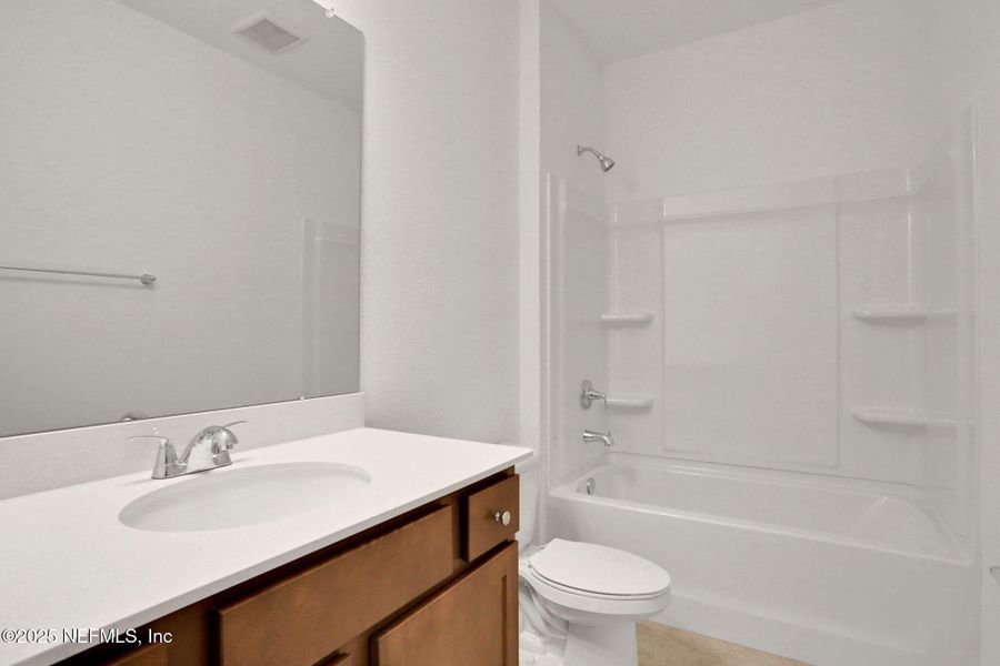 Furnished interior view inside a new home in TrailMark, St. Augustine (Image 10).