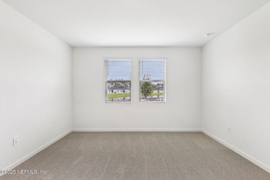 Spacious, unfurnished interior of a new home in Lakes at Bella Lago - Signature Series, Green Cove Springs (Image 28).