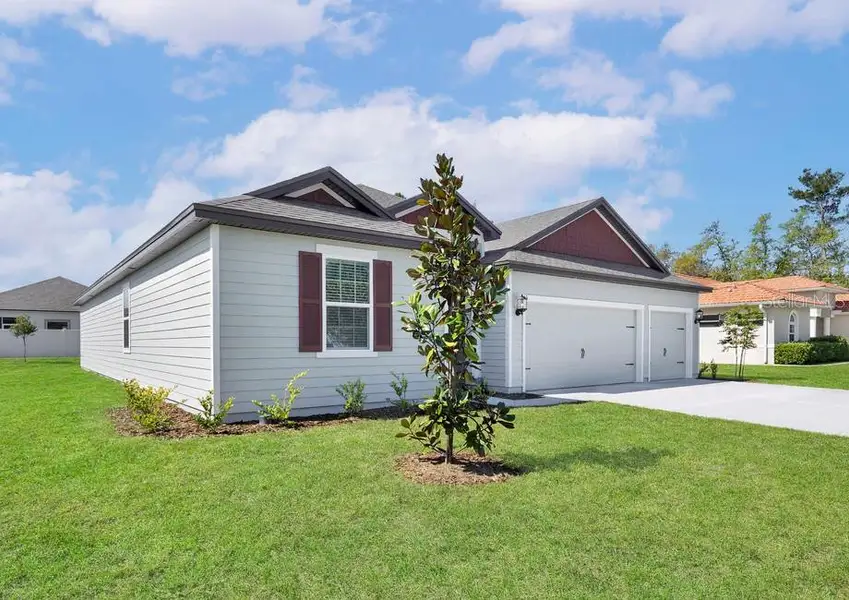 Front exterior of a new home in Marion Oaks, Ocala, FL, highlighting curb appeal (Image 1).