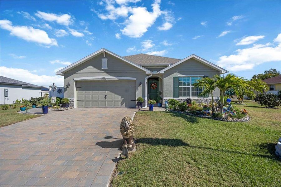 Front exterior of a new home in Burnt Store Village, Punta Gorda, FL, highlighting curb appeal (Image 24).