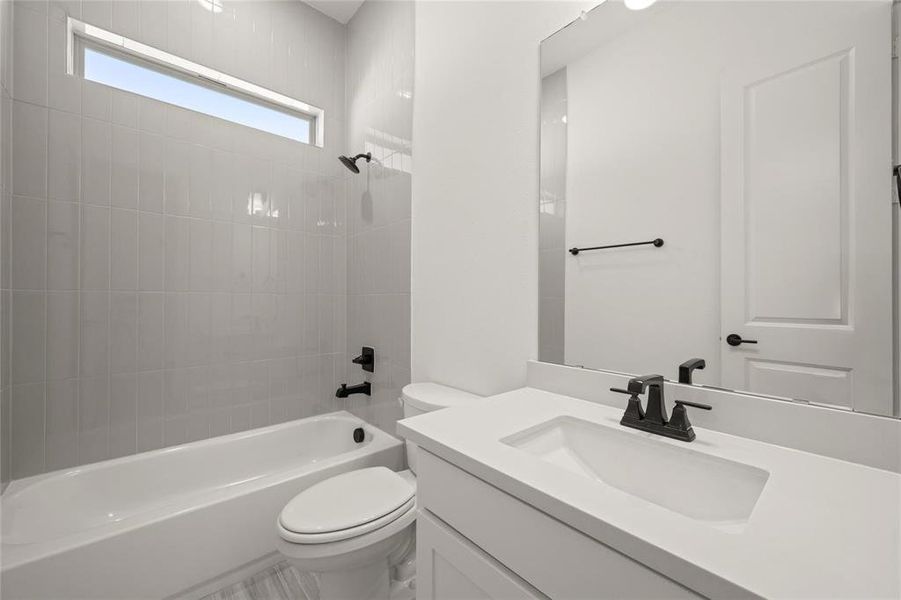 Bathroom featuring vanity and shower / washtub combination