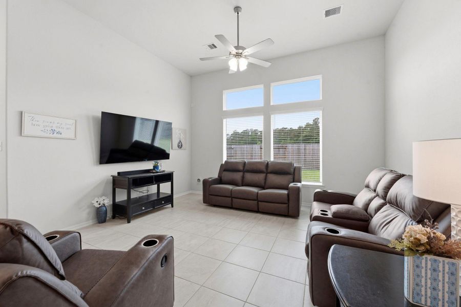 Relax in a light-filled living area featuring tall ceilings, expansive windows, and a clean modern aesthetic. Relax in a light-filled living area featuring tall ceilings, expansive windows, and a clean modern aesthetic.