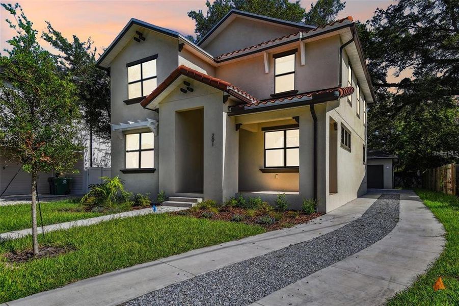 Front exterior of a new home in , St. Petersburg, FL, highlighting curb appeal (Image 2). Front exterior of a new home in , St. Petersburg, FL, highlighting curb appeal (Image 2).