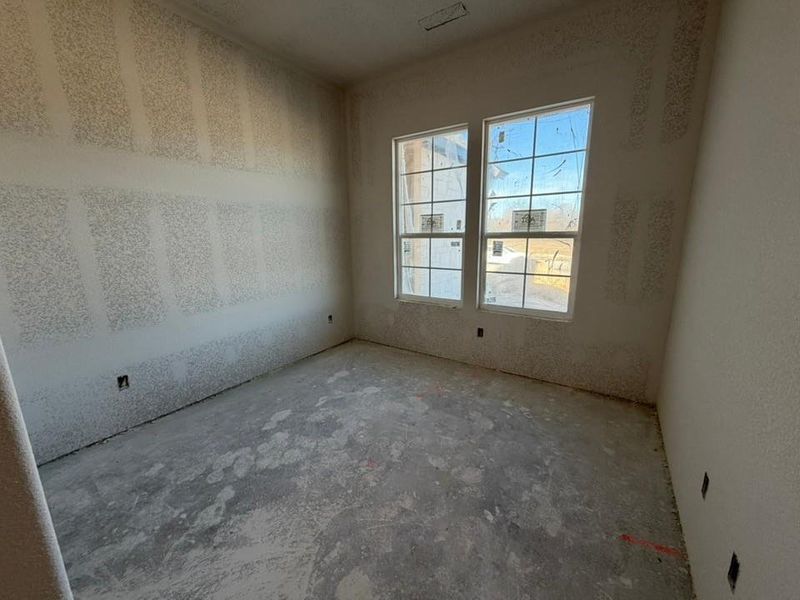 Unfurnished room featuring concrete floors
