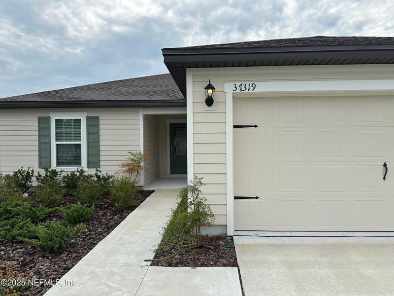 Front exterior of a new home in , Hilliard, FL, highlighting curb appeal (Image 10). Front exterior of a new home in , Hilliard, FL, highlighting curb appeal (Image 10).