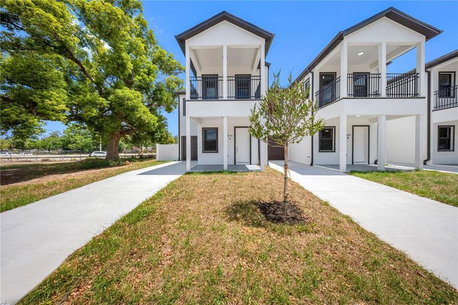 Front exterior of a new home in , Tampa, FL, highlighting curb appeal (Image 25).