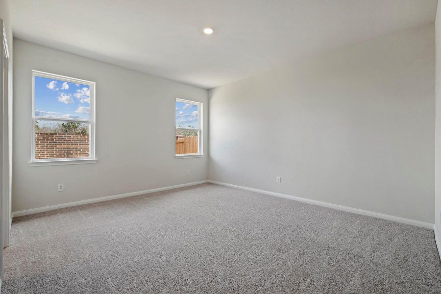 Spacious, unfurnished interior of a new home in Canterra Creek, Iowa Colony (Image 8).