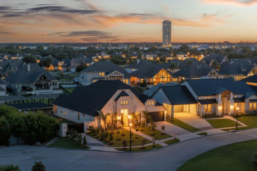 Welcome to Cypress Bay. Beautiful twilight view showcasing the home’s exterior lighting and surrounding neighborhood ambiance.