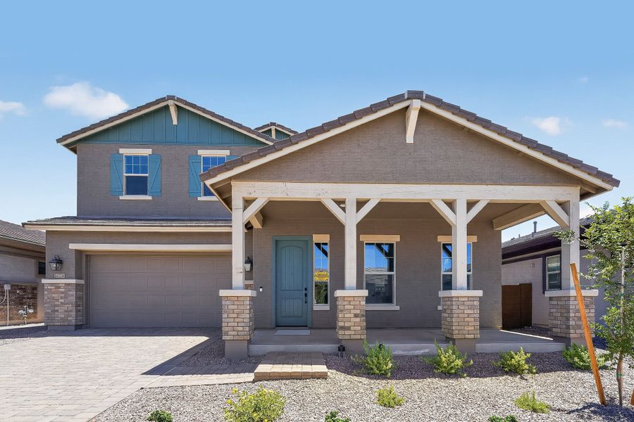 Front exterior of a new home in Ellsworth Ranch, Queen Creek, AZ, highlighting curb appeal (Image 1). Front exterior of a new home in Ellsworth Ranch, Queen Creek, AZ, highlighting curb appeal (Image 1).