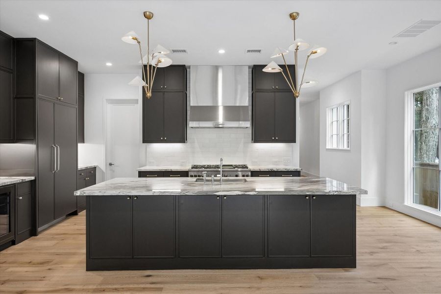 Marble top center Island with bench made cabinetry in the Kitchen Marble top center Island with bench made cabinetry in the Kitchen