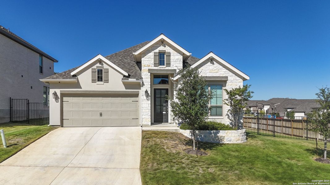 Front exterior of a new home in Cibolo Canyons 50', San Antonio, TX, highlighting curb appeal (Image 2). Front exterior of a new home in Cibolo Canyons 50', San Antonio, TX, highlighting curb appeal (Image 2).