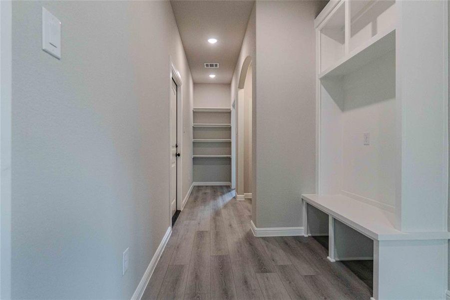 Mudroom with hardwood / wood-style flooring