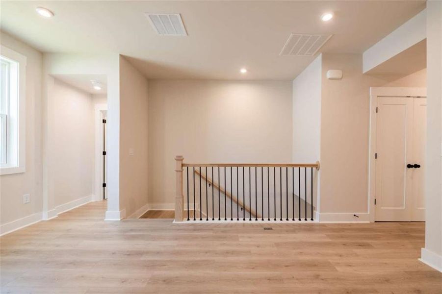 Spacious, unfurnished interior of a new home in The Paddocks at Doc Hughes, Buford (Image 43).