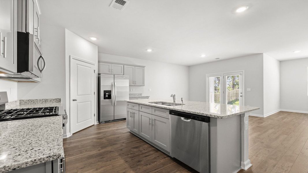 Representative furnished interior of a home built from the Cali by D.R. Horton in Highland Hills, Graniteville (Image 4).