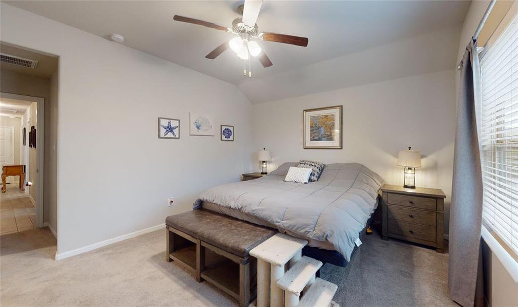 Another look at the primary bedroom.  Note that it accommodates 2 good-sized nightstands on either side of the bed.