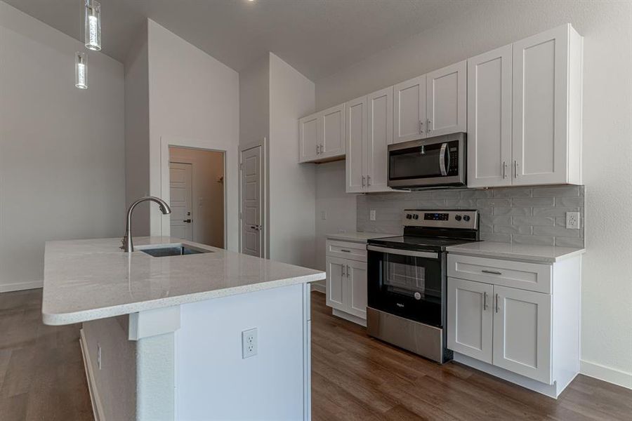 Kitchen with pantry and entry to laundry room and garage