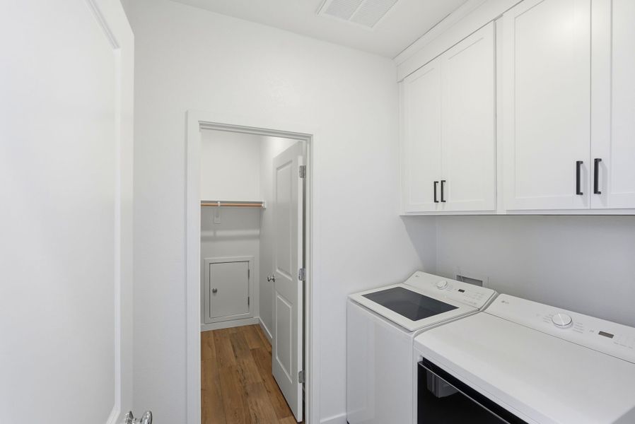 A kitchen with white cabinets. A kitchen with white cabinets.