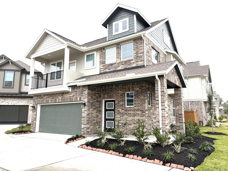 Front exterior of a new home in Balmoral, Humble, TX, highlighting curb appeal (Image 18).