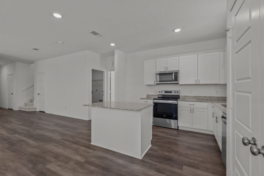 Eat-in island kitchen and abundant cabinet space