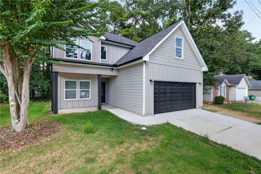 Front exterior of a new home in , Lithonia, GA, highlighting curb appeal (Image 23).