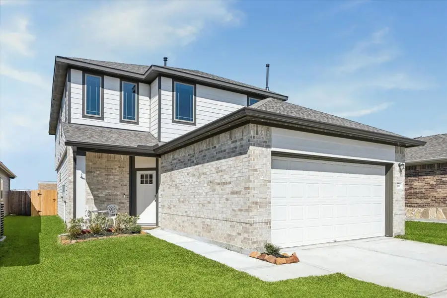 Front exterior of a new home in , Bellville, TX, highlighting curb appeal (Image 1). Front exterior of a new home in , Bellville, TX, highlighting curb appeal (Image 1).