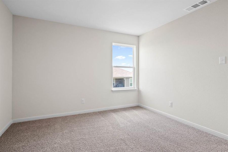 Unfurnished room featuring carpet flooring and baseboards Unfurnished room featuring carpet flooring and baseboards