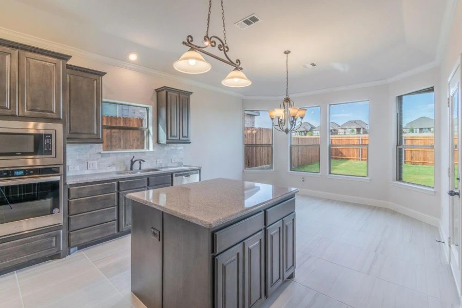 Kitchen | Concept 2027 at Abe's Landing in Granbury, TX by Landsea Homes