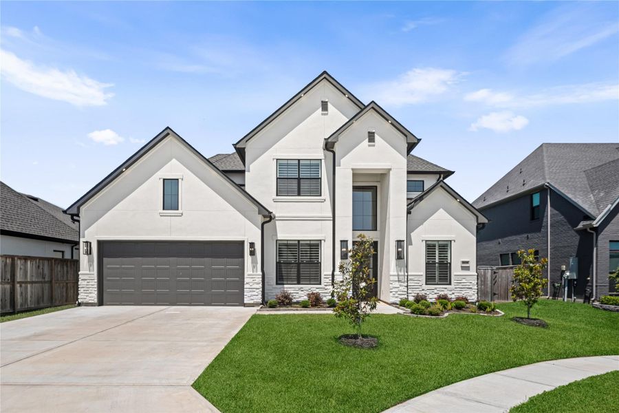 Front exterior of a new home in , Friendswood, TX, highlighting curb appeal (Image 1). Front exterior of a new home in , Friendswood, TX, highlighting curb appeal (Image 1).