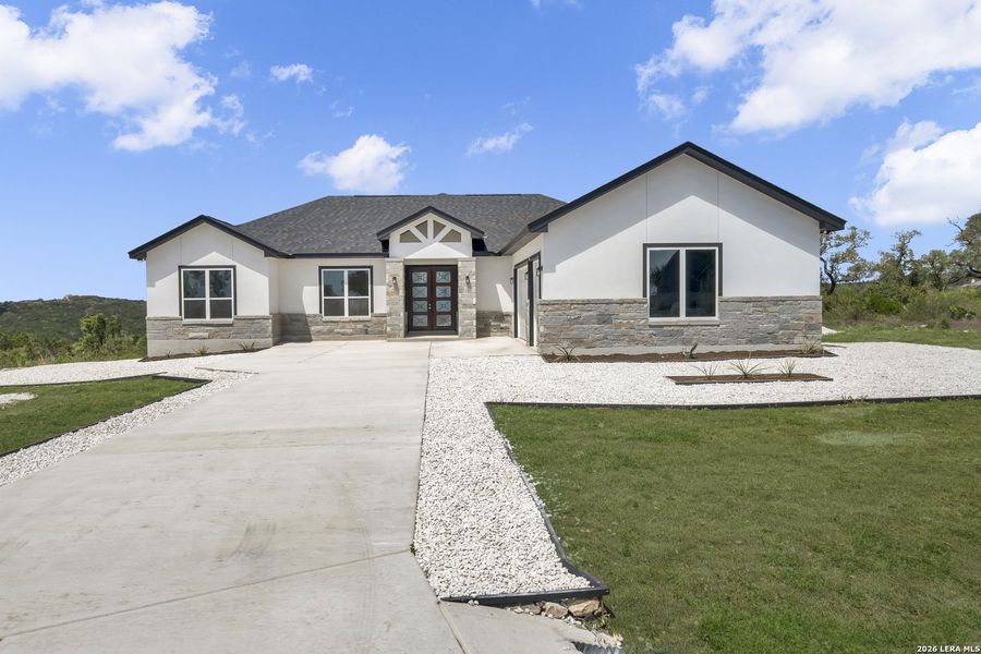 Front exterior of a new home in , Mico, TX, highlighting curb appeal (Image 9).