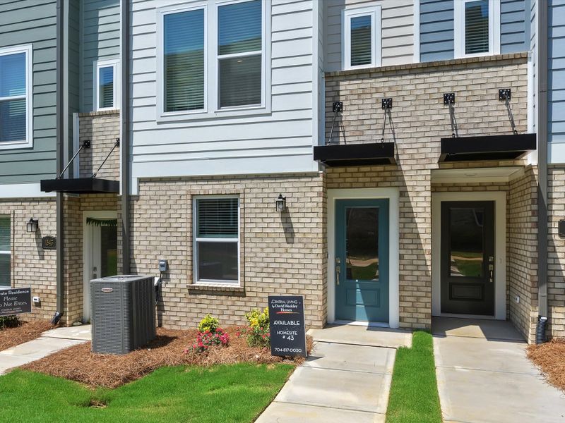 Exterior details and patio area of a home in Central Living at Craig, Charlotte (Image 3).