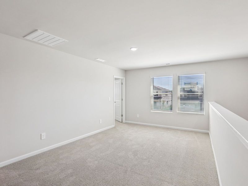 Loft in the Paisley floorplan at a Meritage Homes community in Garner, NC.
