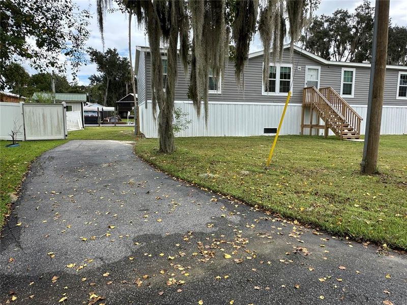 Front exterior of a new home in , Astor, FL, highlighting curb appeal (Image 21). Front exterior of a new home in , Astor, FL, highlighting curb appeal (Image 21).