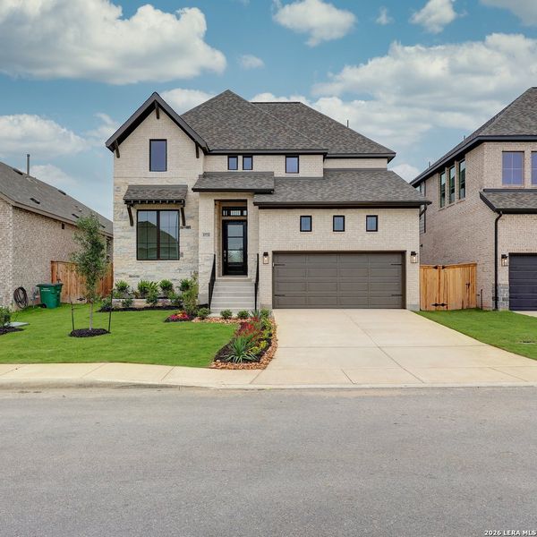 Front exterior of a new home in VIDA, San Antonio, TX, highlighting curb appeal (Image 2).