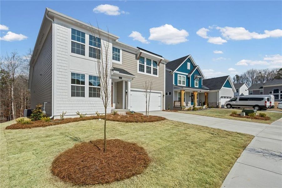 Front exterior of a new home in The Reserve At Liberty Park, Braselton, GA, highlighting curb appeal (Image 20).