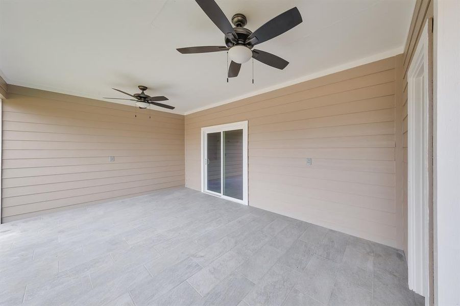 Covered patio deck providing a comfortable outdoor space for relaxing, dining, or entertaining in all weather conditions.