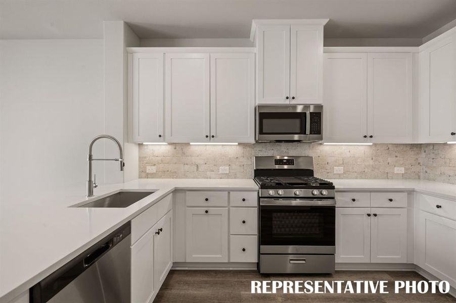 This beautiful kitchen offers beautiful cabinetry, gorgeous countertops and contemporary appliances artfully blended to create a dream kitchen!  REPRESENTATIVE PHOTO