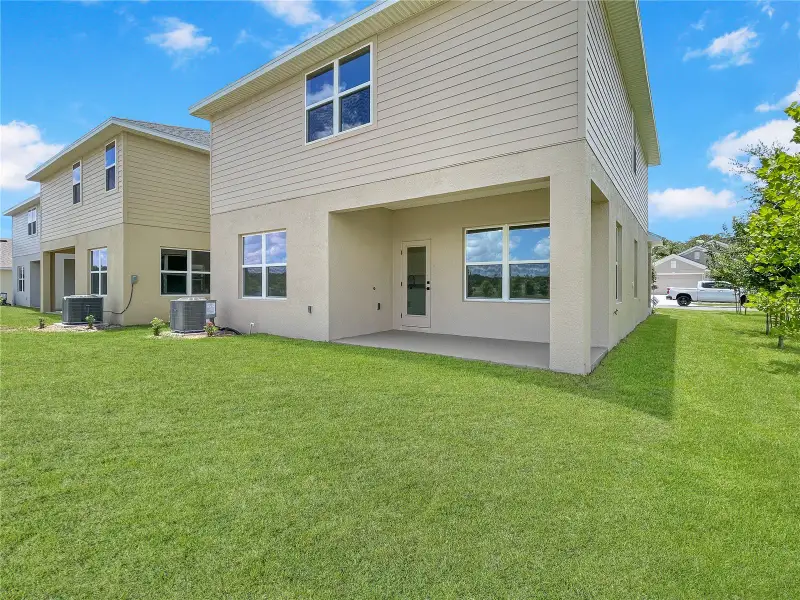 Exterior details and patio area of a home in Harmony Central, St. Cloud (Image 3).