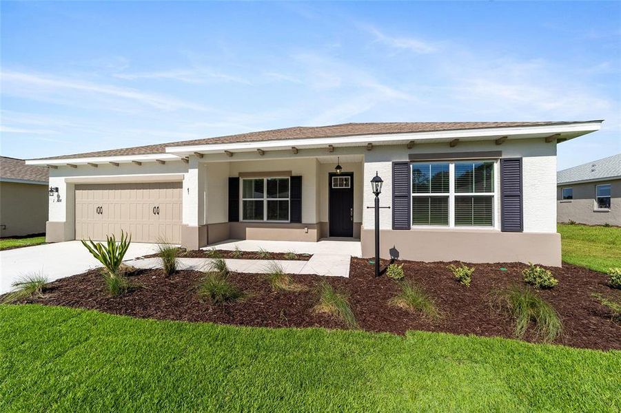 Front exterior of a new home in On Top of the World Communities, Ocala, FL, highlighting curb appeal (Image 14).