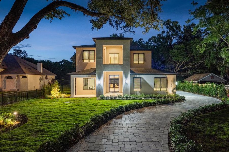 Front exterior of a new home in , Windermere, FL, highlighting curb appeal (Image 22).