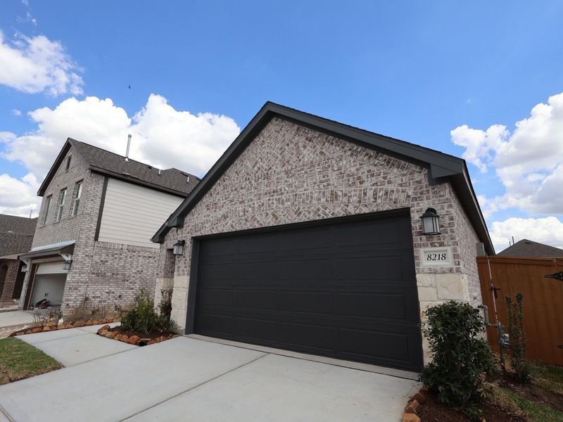 Front exterior of a new home in Marvida, Cypress, TX, highlighting curb appeal (Image 17). Front exterior of a new home in Marvida, Cypress, TX, highlighting curb appeal (Image 17).